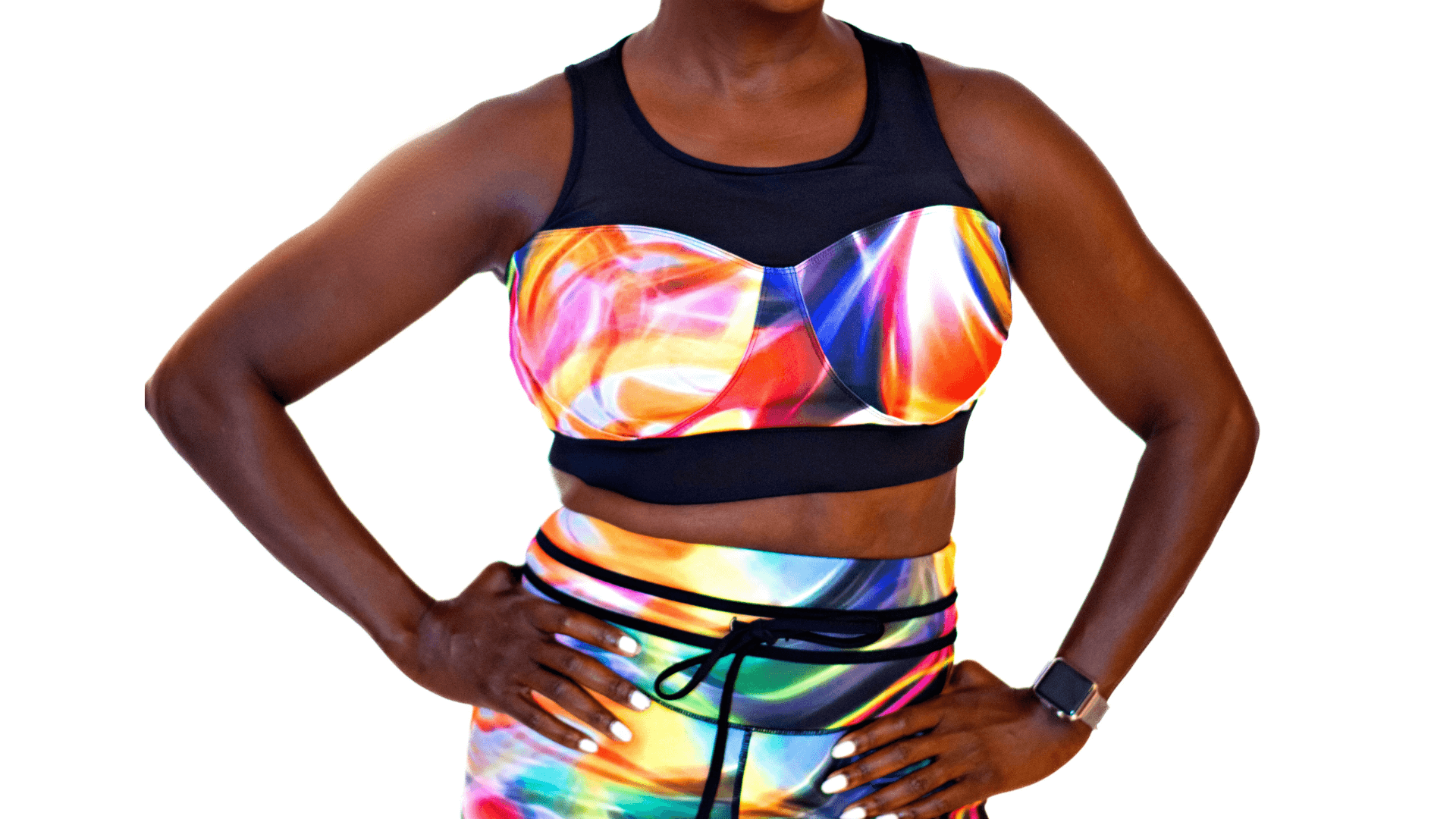 Woman wearing Neon Nirvana Empress Fit Bra with vibrant colors and trendy fitness shorts, showcasing stylish activewear.